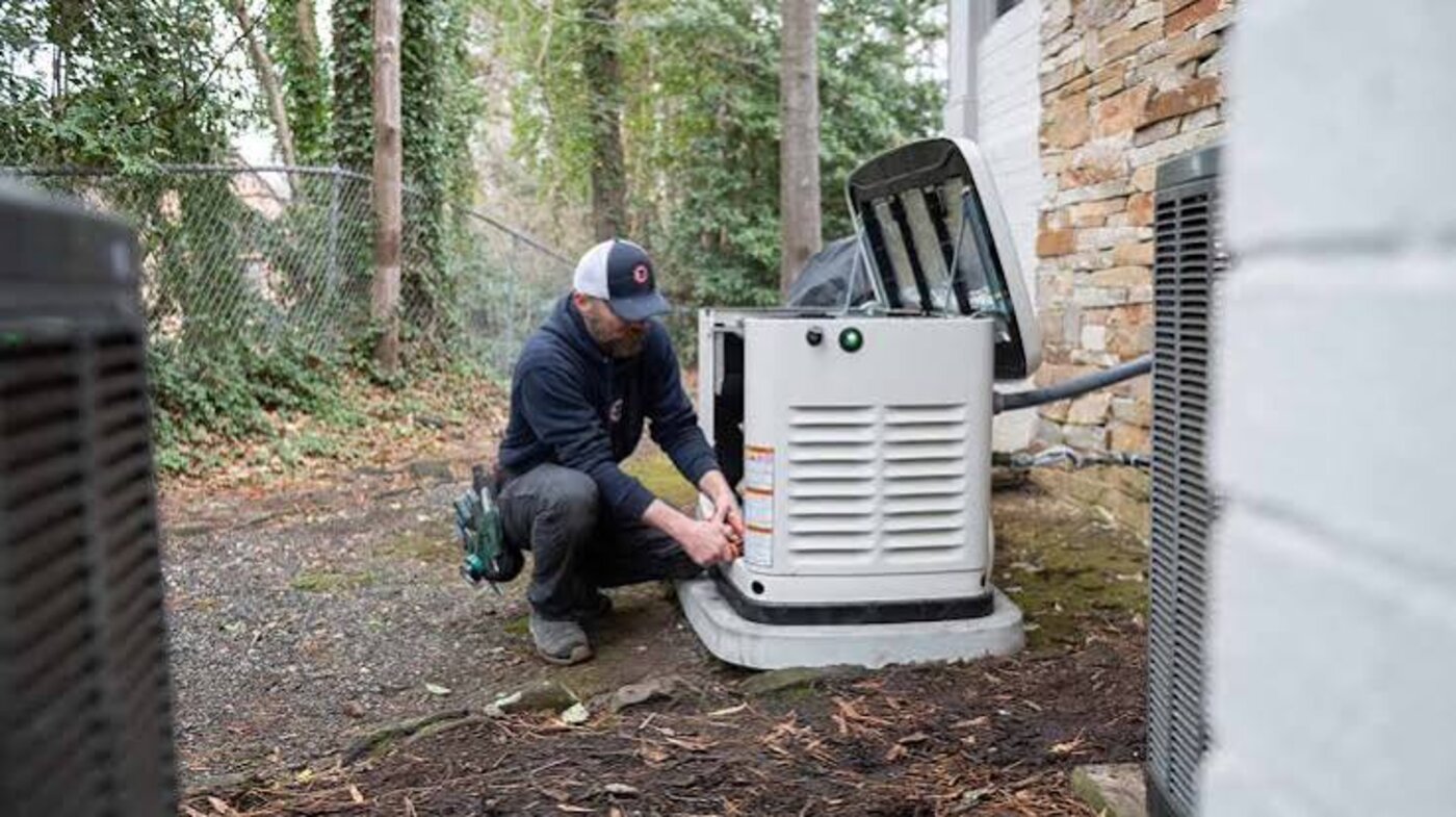 Technician performing generator repair and maintenance service in Sioux Falls, SD